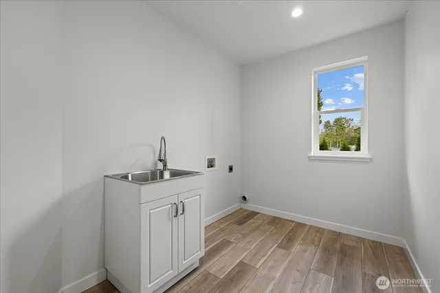 a kitchen with a sink and cabinets