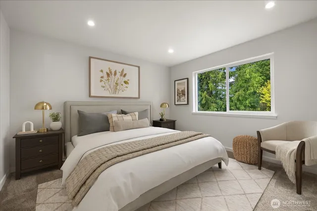 a bedroom with a bed and a couch