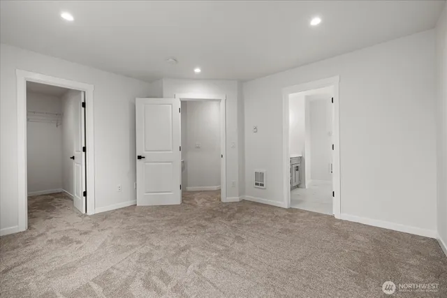 an empty room with closet area