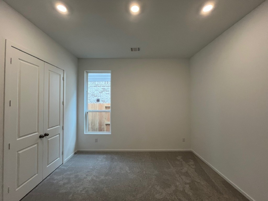 4411 Eagle Pass Drive Rosenberg, TX 77469 - Photo 17 of 33 an empty room with windows and closet