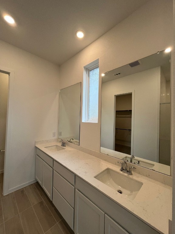 4411 Eagle Pass Drive Rosenberg, TX 77469 - Photo 24 of 33 a bathroom with a sink and a mirror