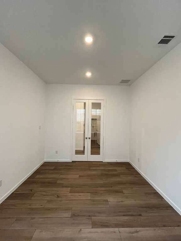 4411 Eagle Pass Drive Rosenberg, TX 77469 - Photo 5 of 33 a view of an empty room with wooden floor and a window