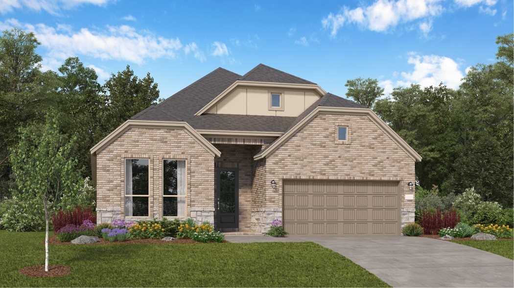 4411 Eagle Pass Drive Rosenberg, TX 77469 - Photo 3 of 33 a front view of a house with a garden and plants