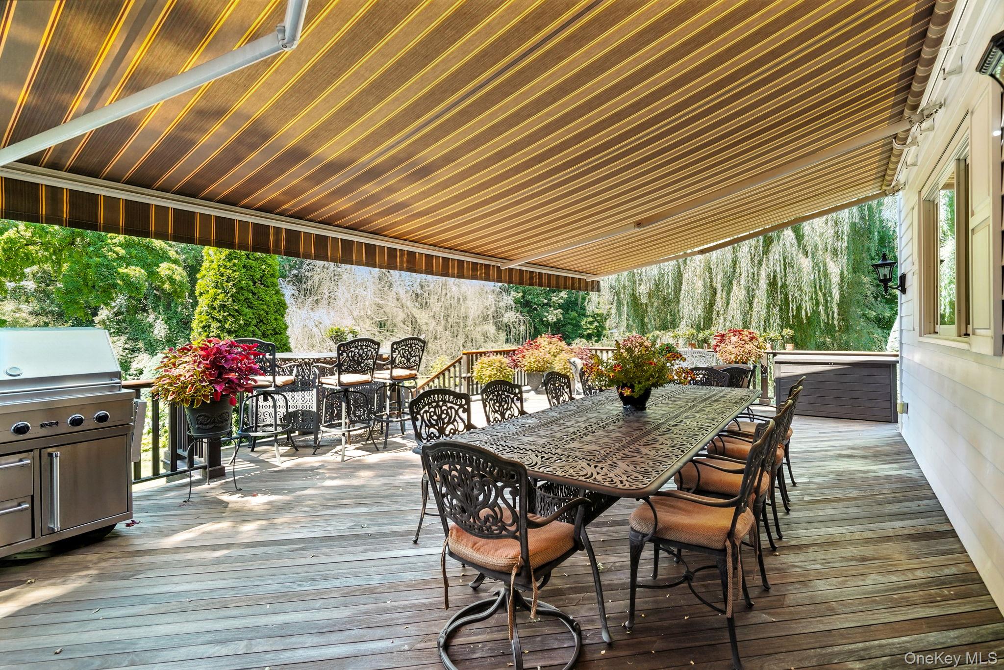 33 Hevelyne Road Elmsford, NY 10523 - Photo 35 of 43 Wooden deck with outdoor dining area and grilling area