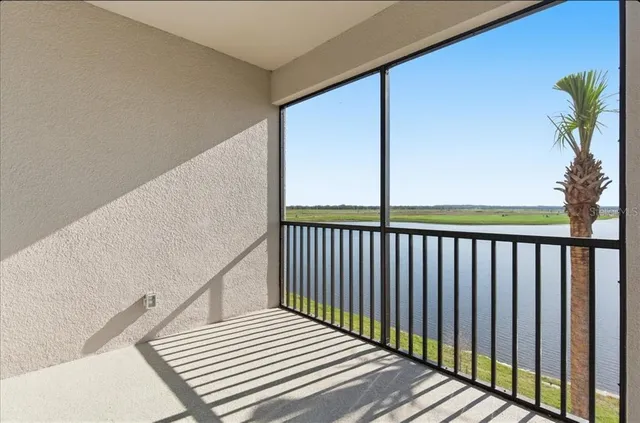 a view of a balcony with wooden floor