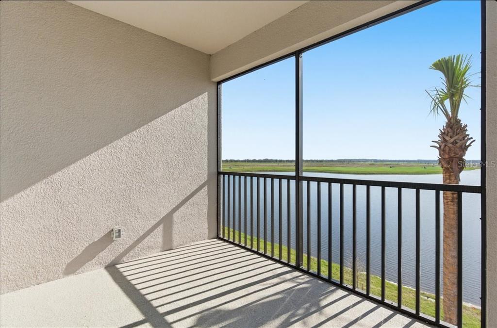 a view of a balcony with wooden floor