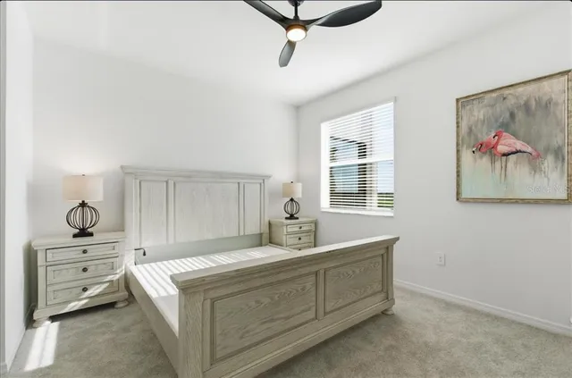 a bedroom with a bed and dresser