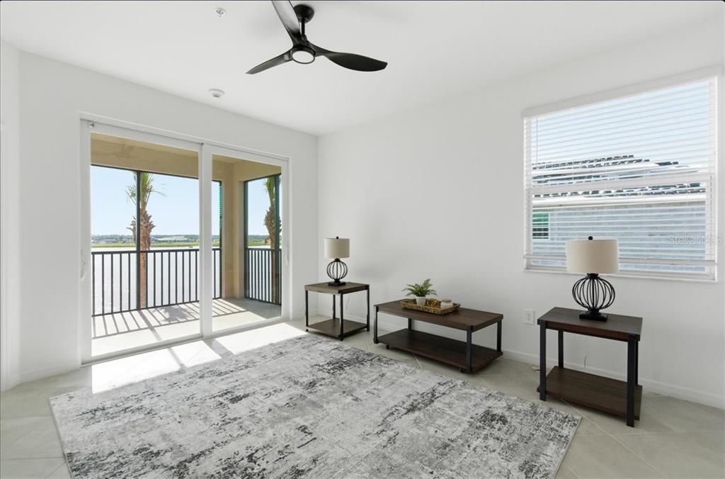 19140 Scallop Loop, Unit 308 Lakewood Ranch, FL 34211 - Photo 9 of 19 a bedroom with furniture and a window