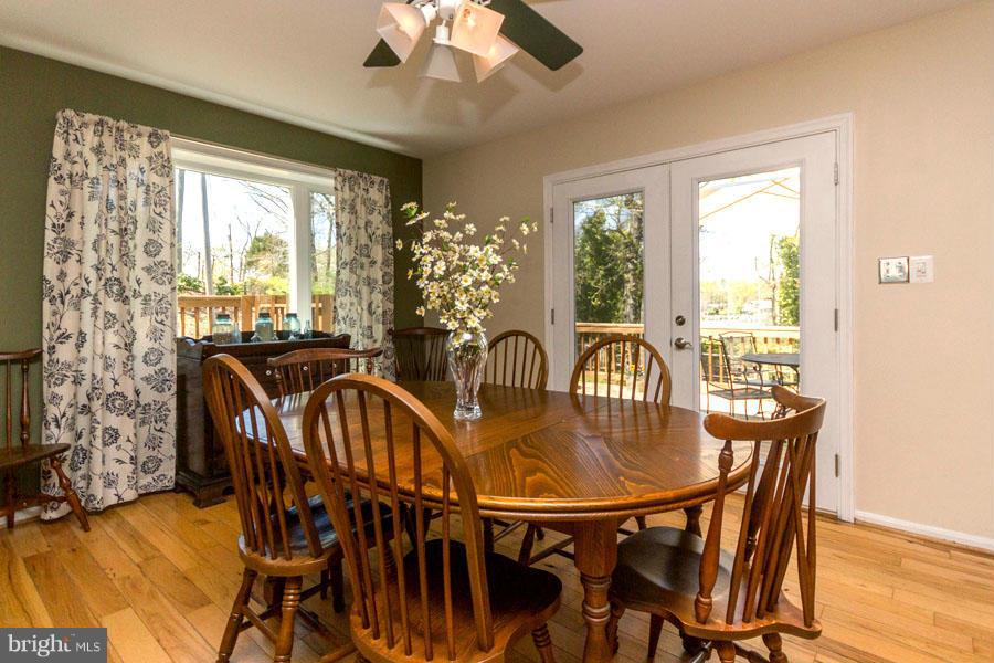 3908 Rhode Harbor Road Edgewater, MD 21037 - Photo 11 of 30 Formal Dining Area Spilling onto Deck