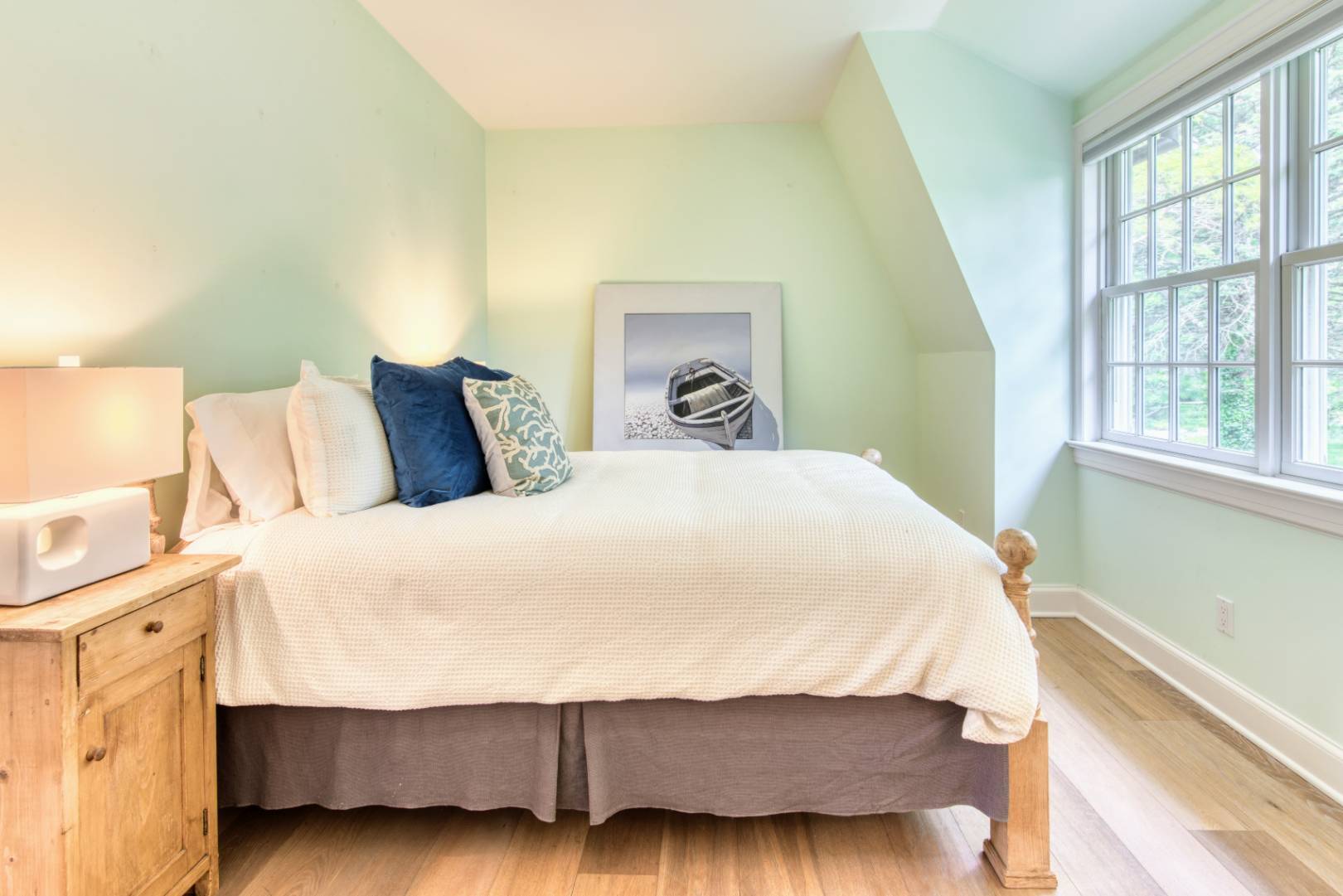 69 Harrison Street Sag Harbor, NY 11963 - Photo 14 of 17 a bedroom with a bed and a window