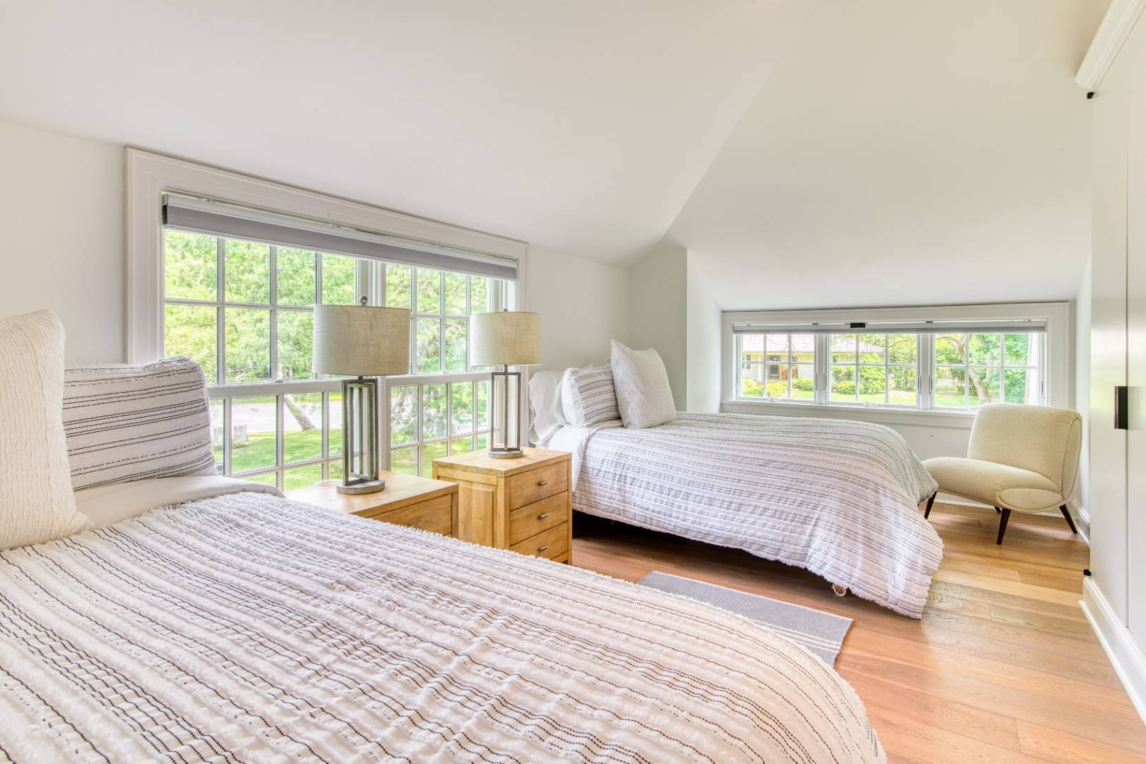 69 Harrison Street Sag Harbor, NY 11963 - Photo 15 of 17 a bedroom with a bed and a large window