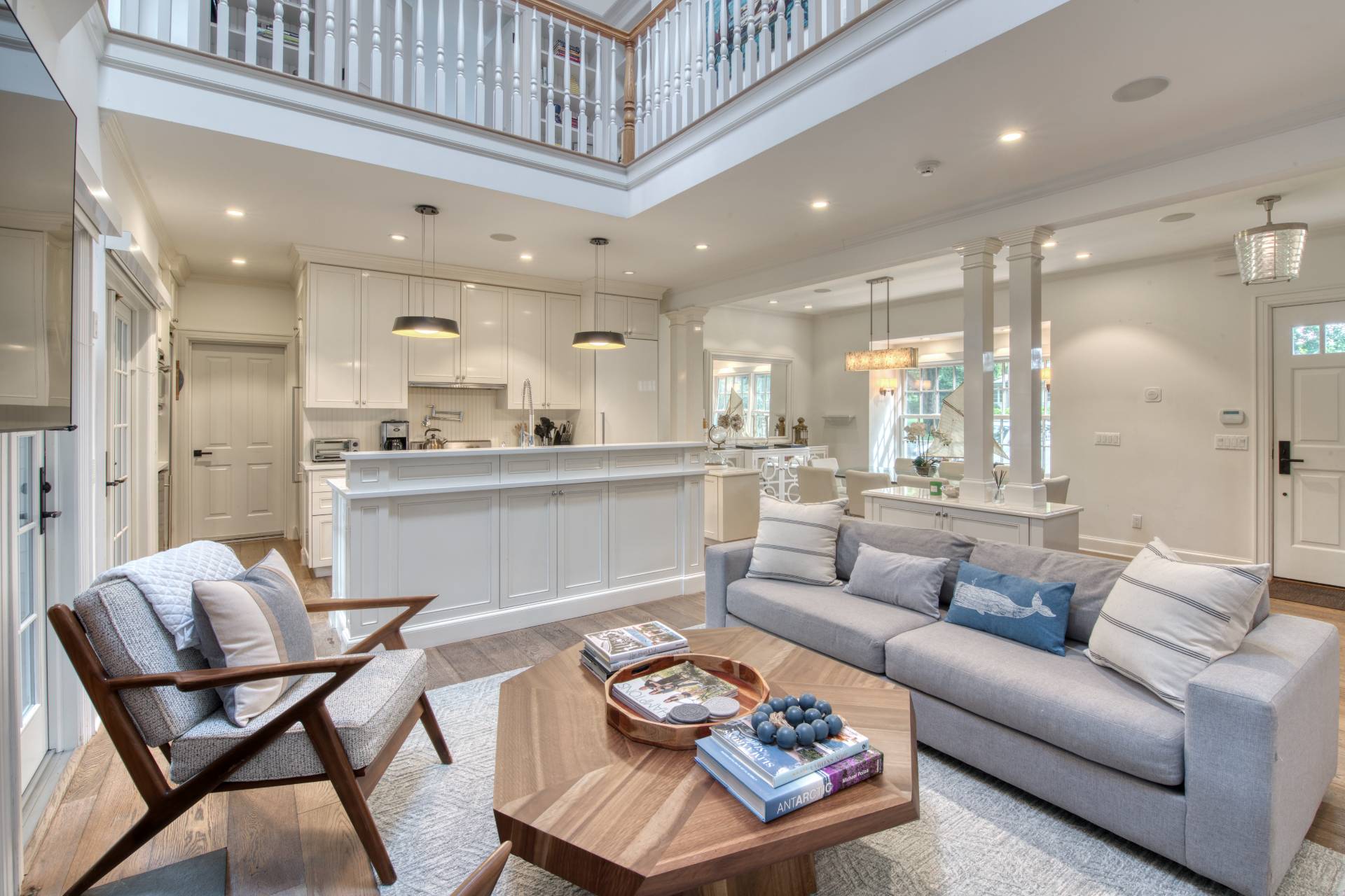 69 Harrison Street Sag Harbor, NY 11963 - Photo 4 of 17 a living room with furniture and a view of kitchen