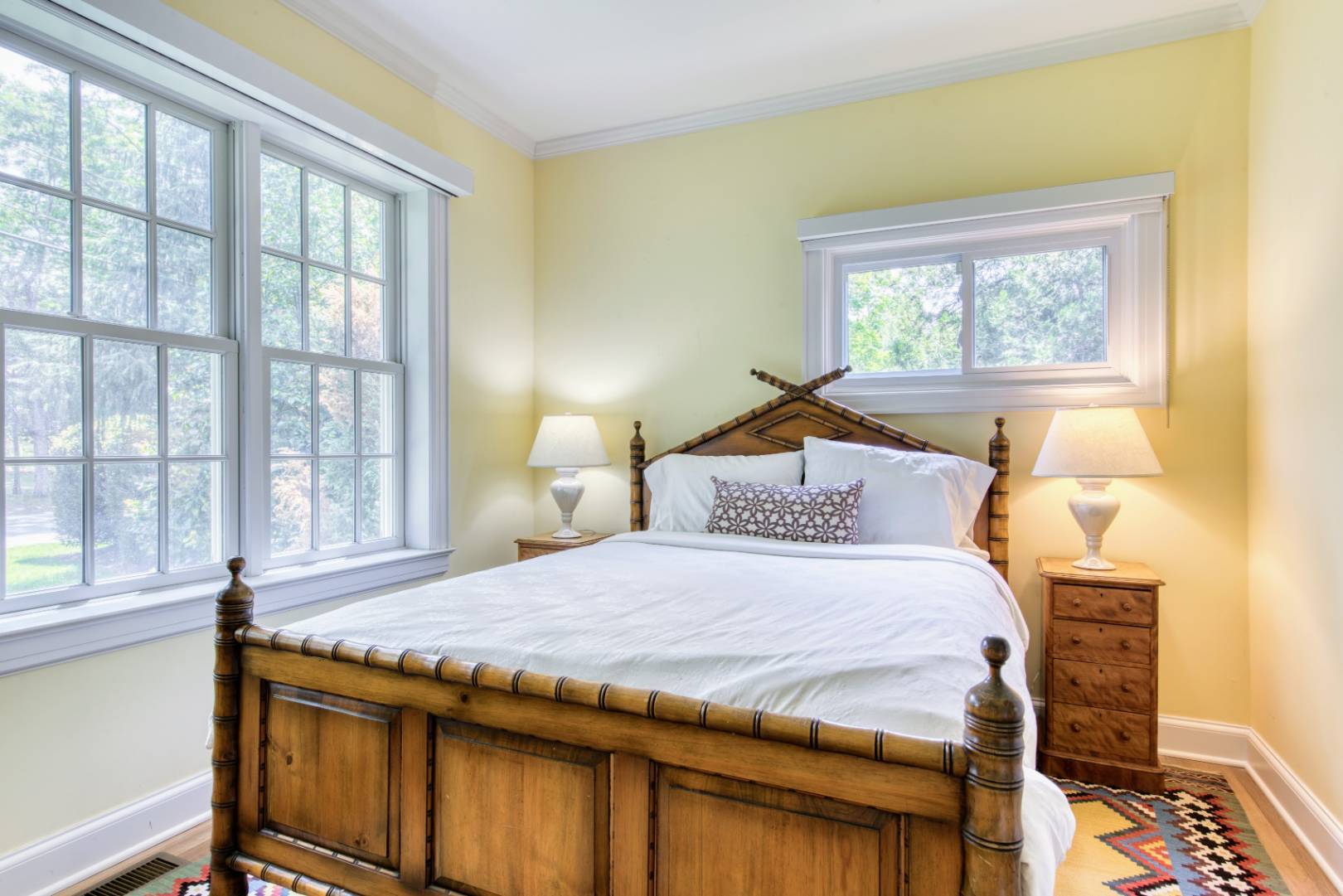 69 Harrison Street Sag Harbor, NY 11963 - Photo 9 of 17 a bedroom with a bed and a window