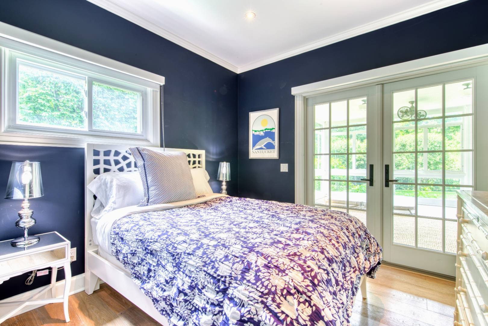 69 Harrison Street Sag Harbor, NY 11963 - Photo 10 of 17 a bedroom with a large bed and a large window