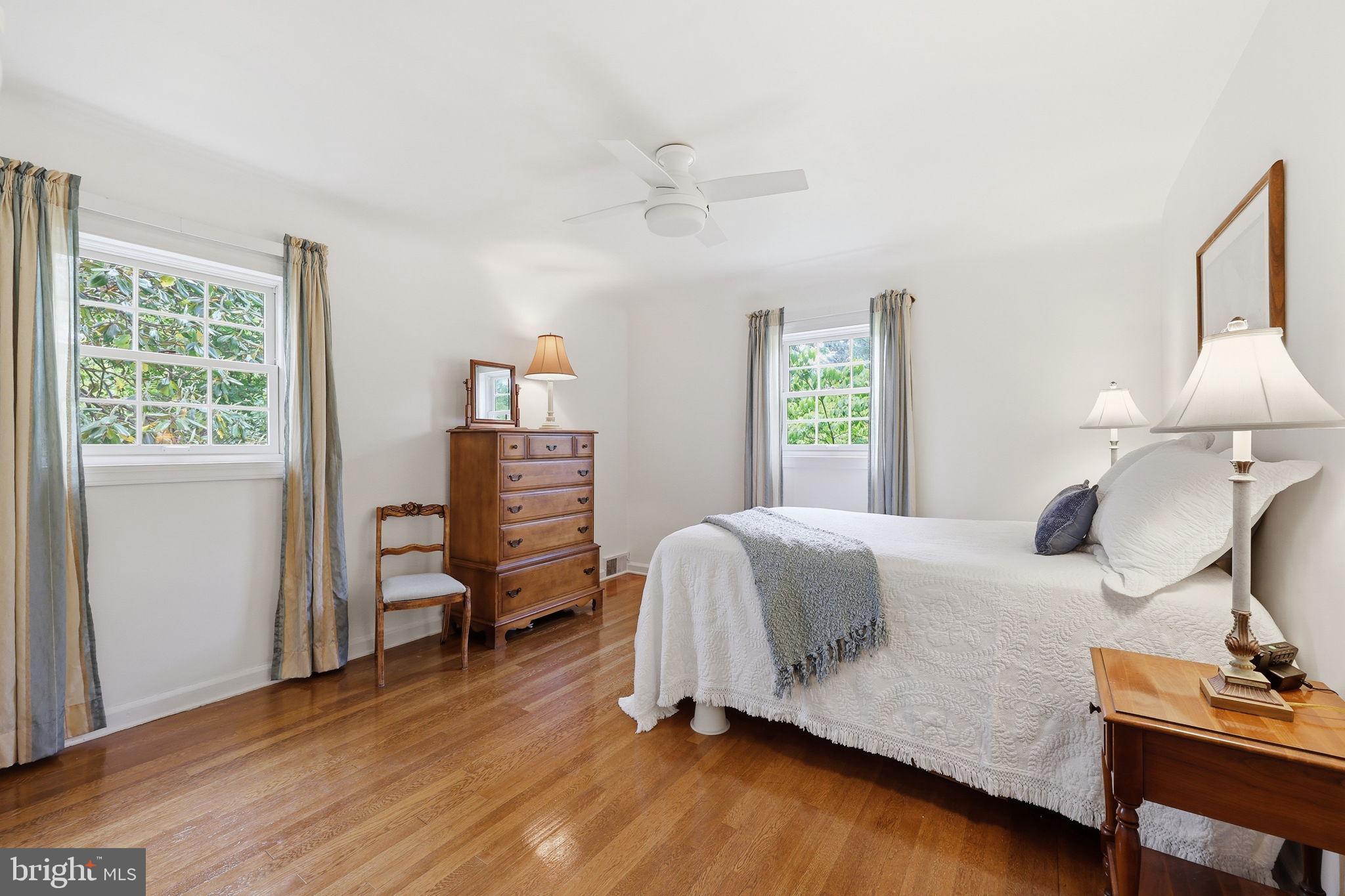 7601 Hollins Road Henrico, VA 23229 - Photo 19 of 47 a bedroom with a bed and wooden floor