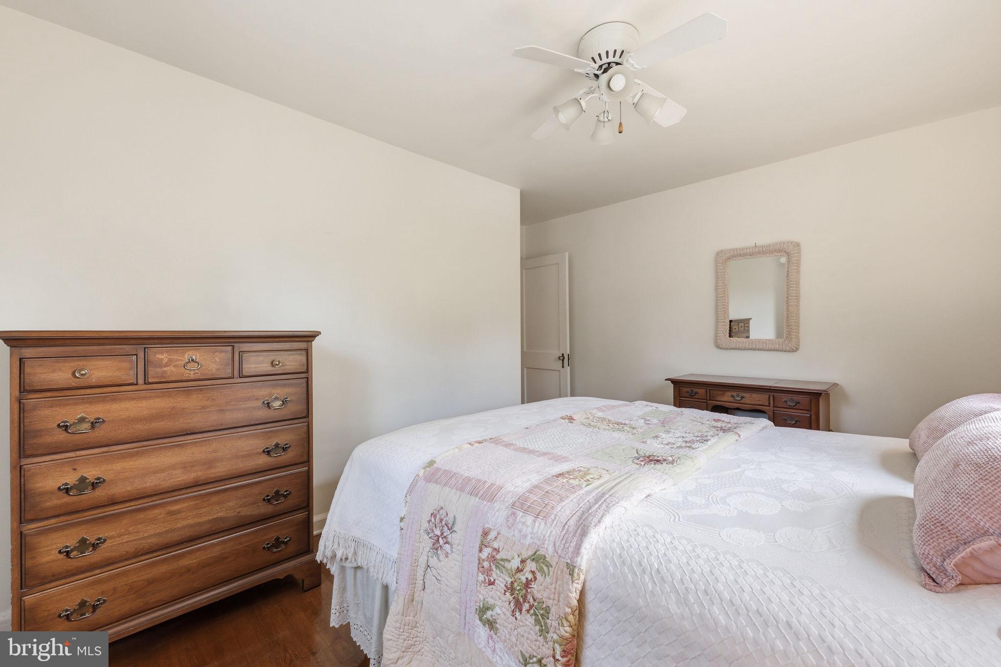 7601 Hollins Road Henrico, VA 23229 - Photo 21 of 47 a bedroom with a bed and a dresser