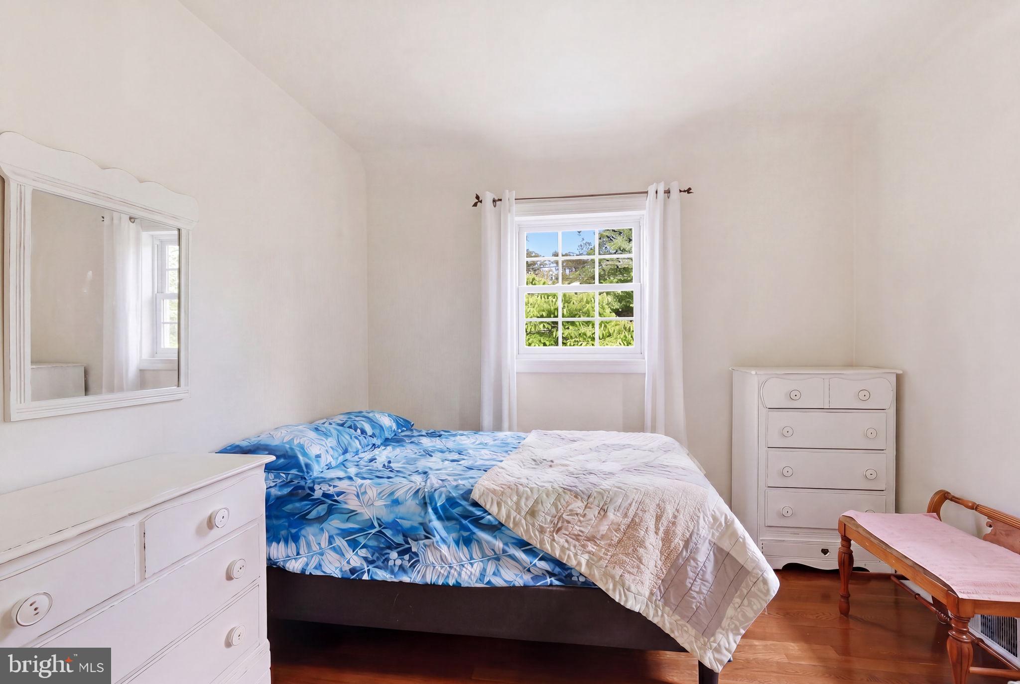 7601 Hollins Road Henrico, VA 23229 - Photo 23 of 47 a bedroom with a bed and a window