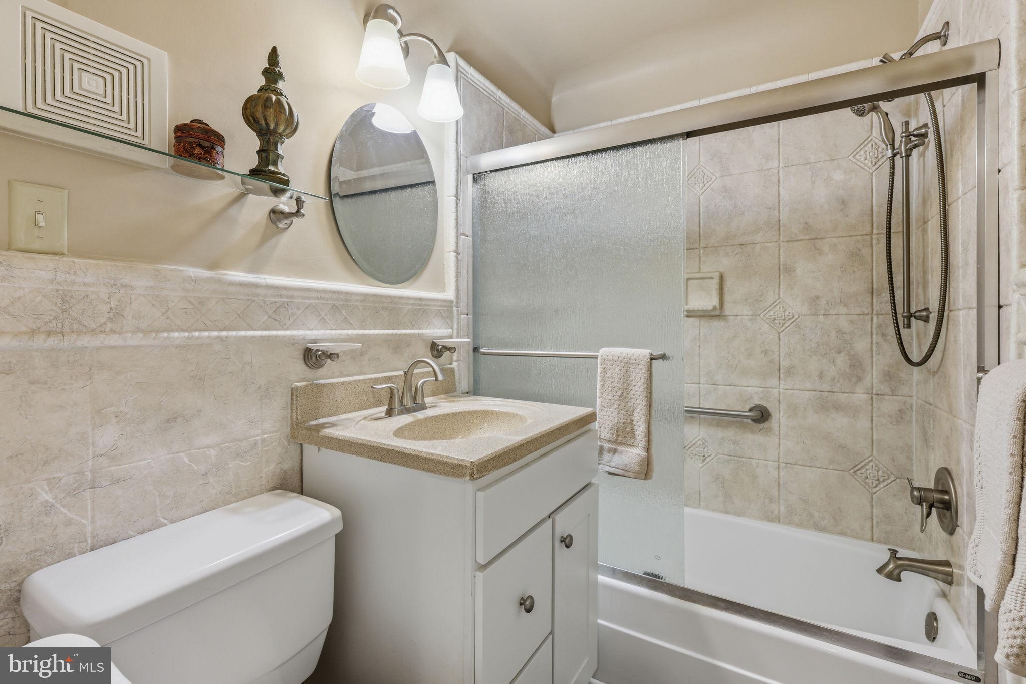 7601 Hollins Road Henrico, VA 23229 - Photo 24 of 47 a bathroom with a sink toilet and shower