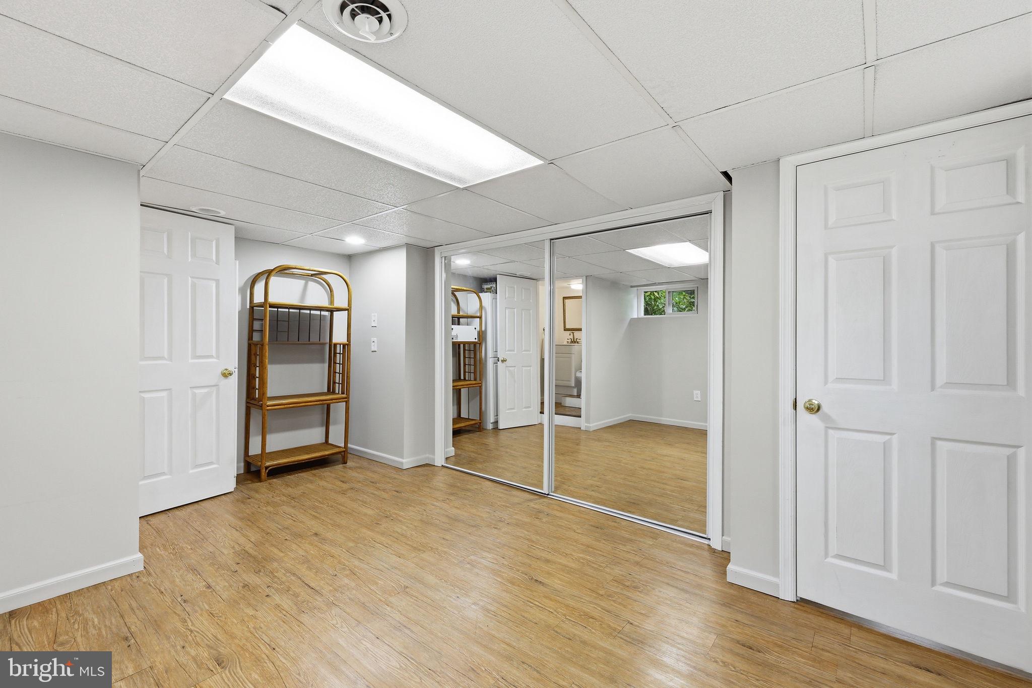 7601 Hollins Road Henrico, VA 23229 - Photo 26 of 47 a view of empty room with wooden floor