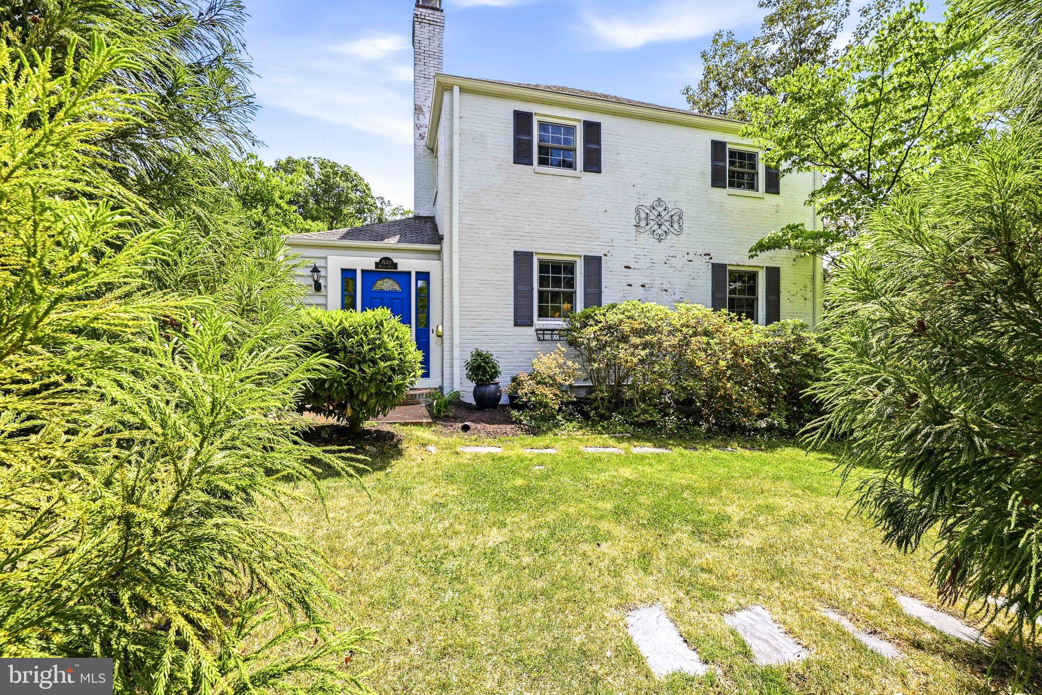7601 Hollins Road Henrico, VA 23229 - Photo 34 of 47 a view of house with backyard and trees