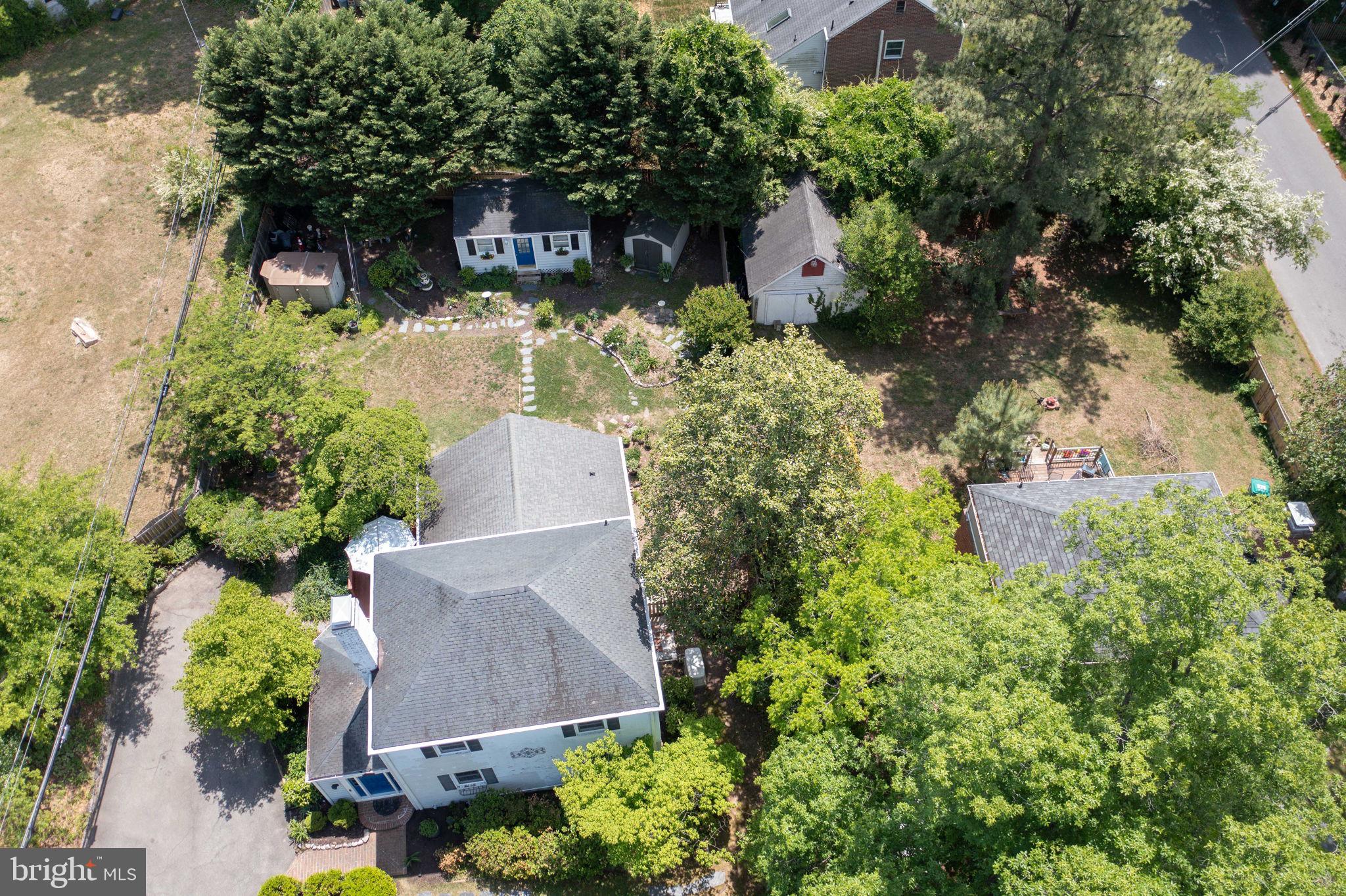 7601 Hollins Road Henrico, VA 23229 - Photo 43 of 47 an aerial view of a house with a yard and garden