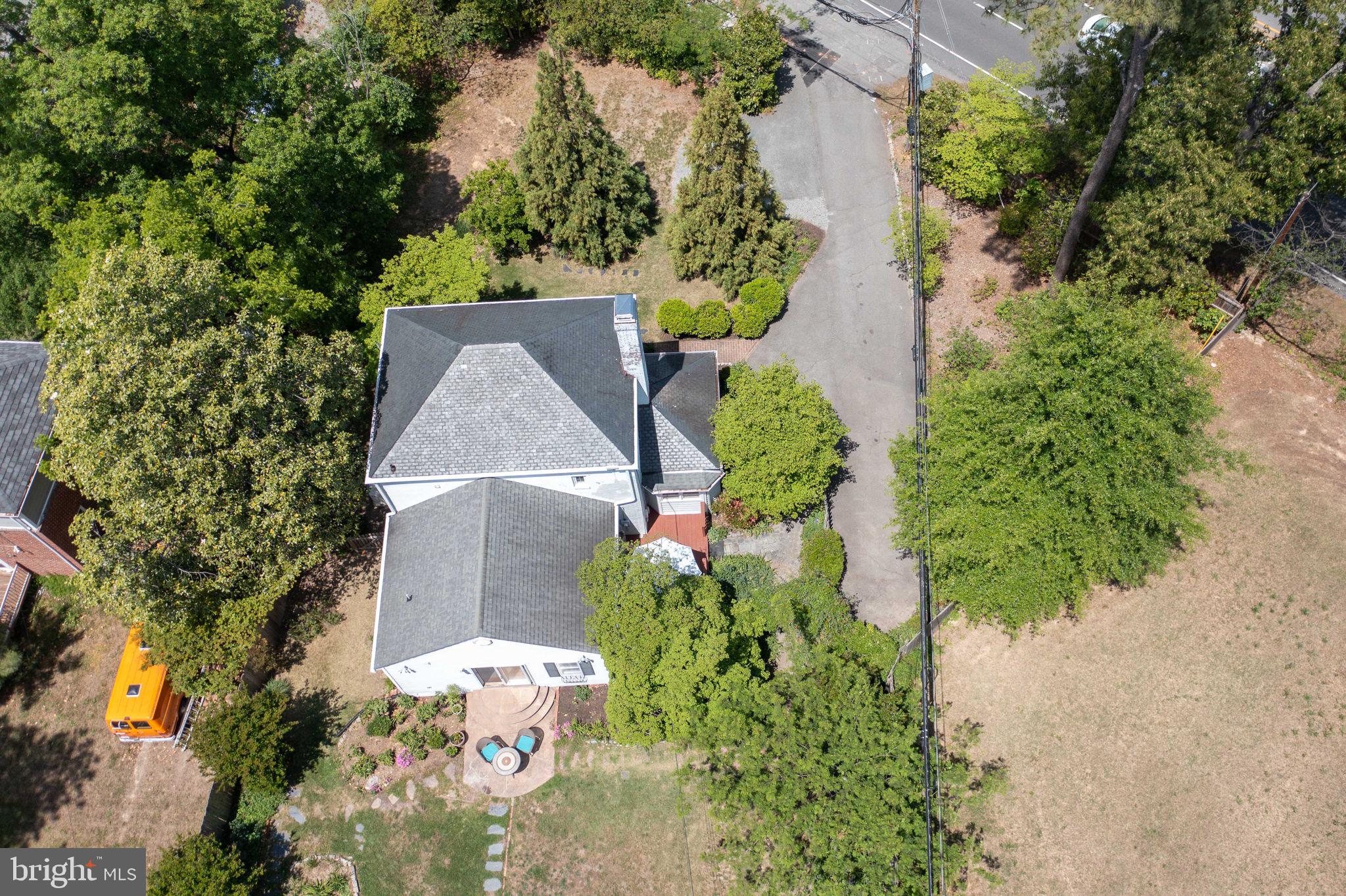 7601 Hollins Road Henrico, VA 23229 - Photo 45 of 47 an aerial view of a house with a yard and large trees