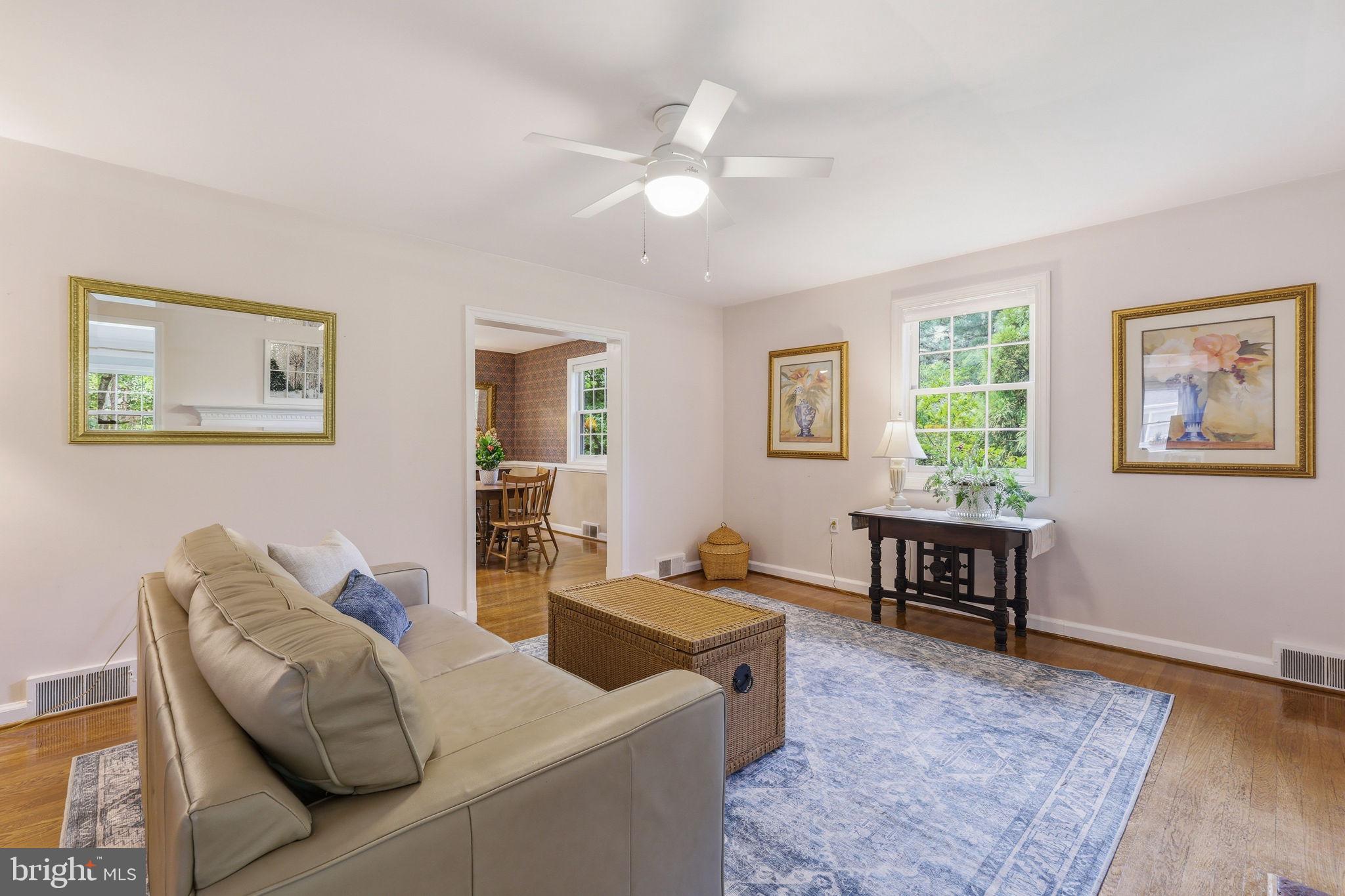 7601 Hollins Road Henrico, VA 23229 - Photo 6 of 47 a living room with furniture and a wooden floor
