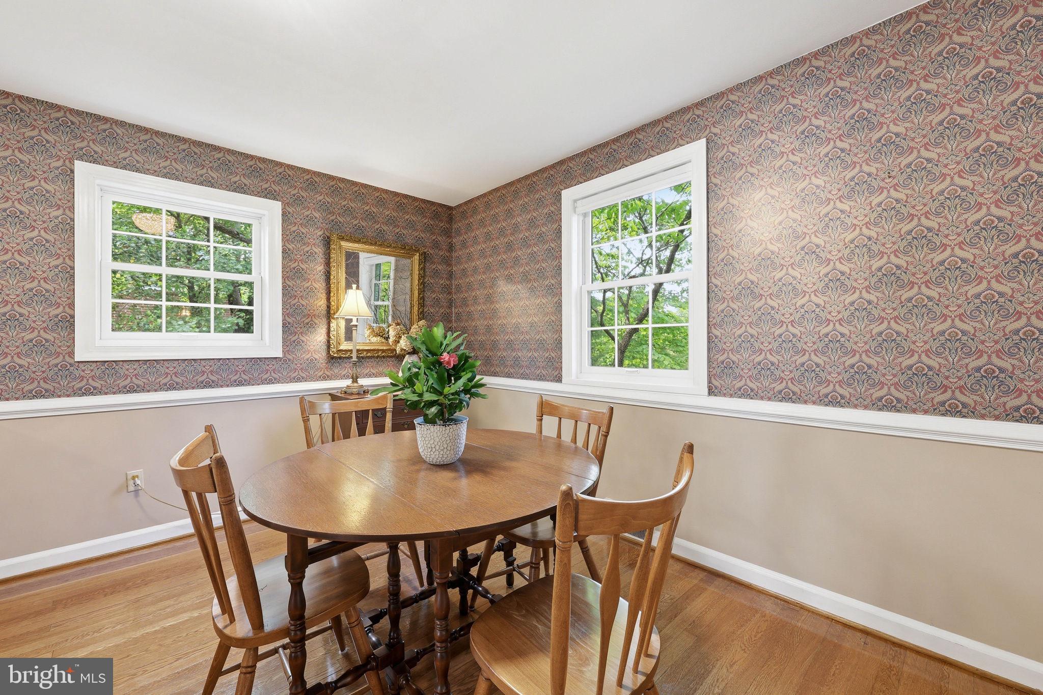 7601 Hollins Road Henrico, VA 23229 - Photo 7 of 47 a view of a dining room with furniture and a potted plant