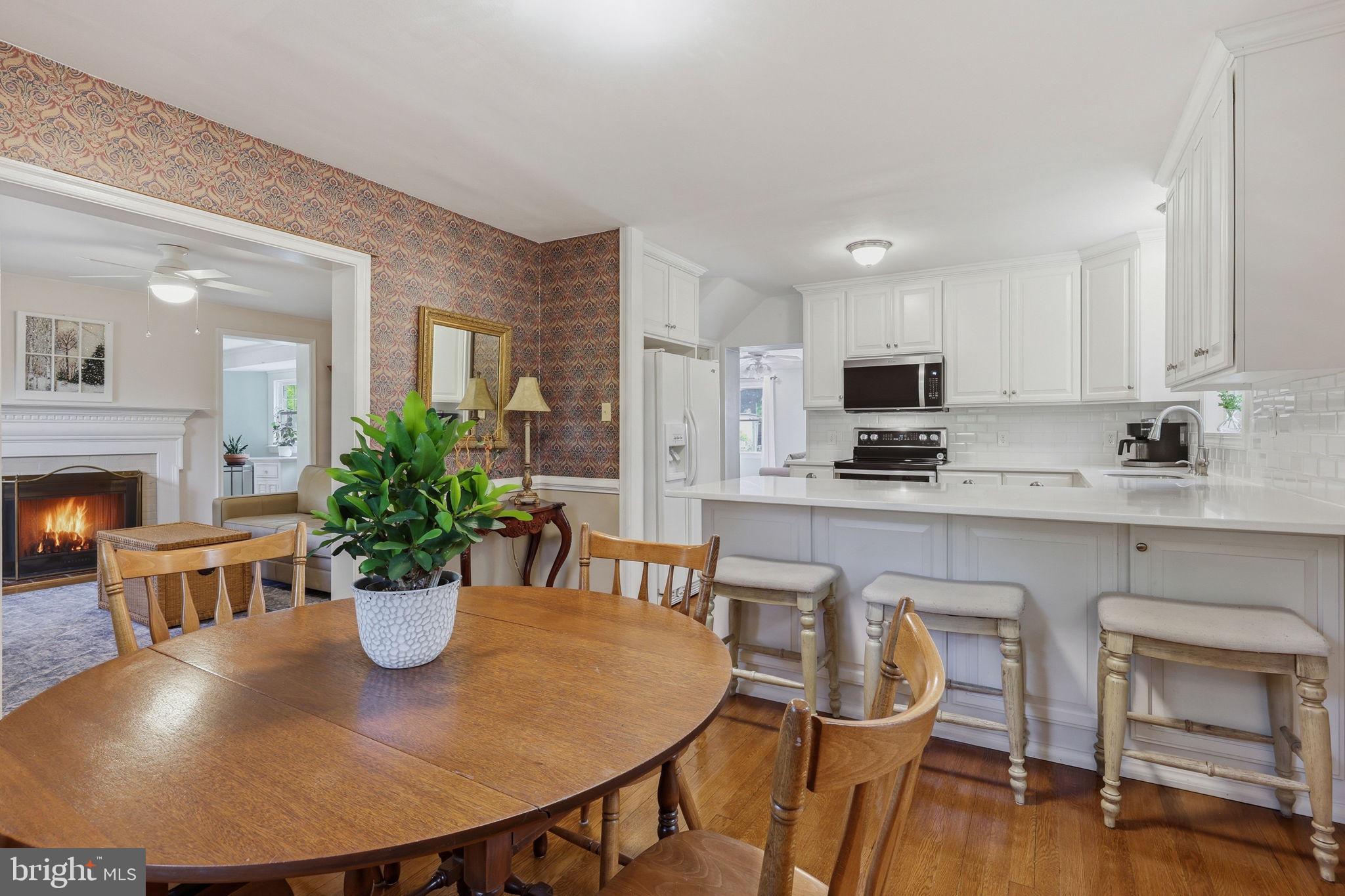 7601 Hollins Road Henrico, VA 23229 - Photo 9 of 47 a view of a dining room with furniture and wooden floor