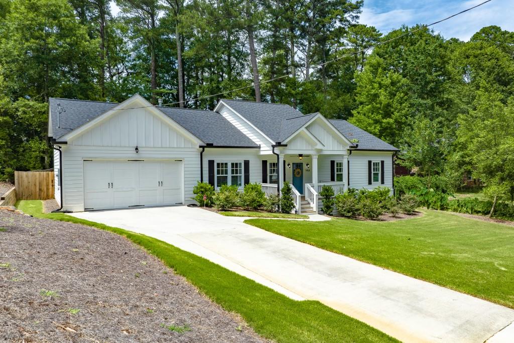 1454 Linkwood Lane Decatur, GA 30033 - Photo 1 of 1 a front view of a house with a yard and garage