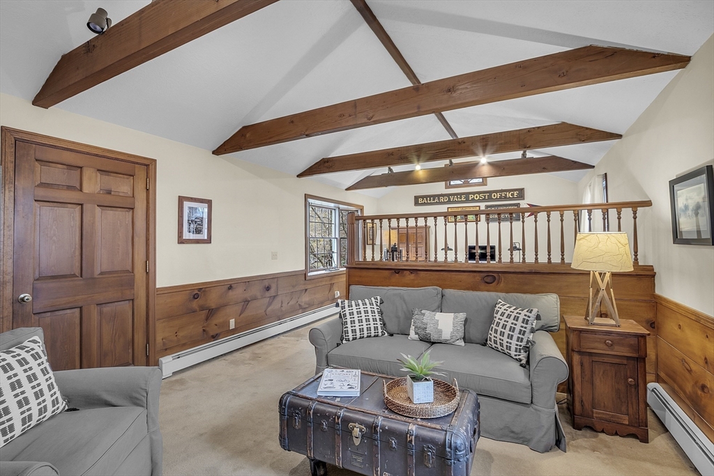 9 Carlisle Street Andover, MA 01810 - Photo 18 of 42 a living room with furniture and a rug