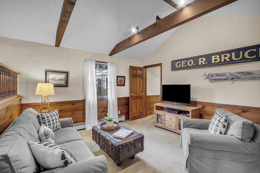 9 Carlisle Street Andover, MA 01810 - Photo 19 of 42 a living room with furniture and a flat screen tv