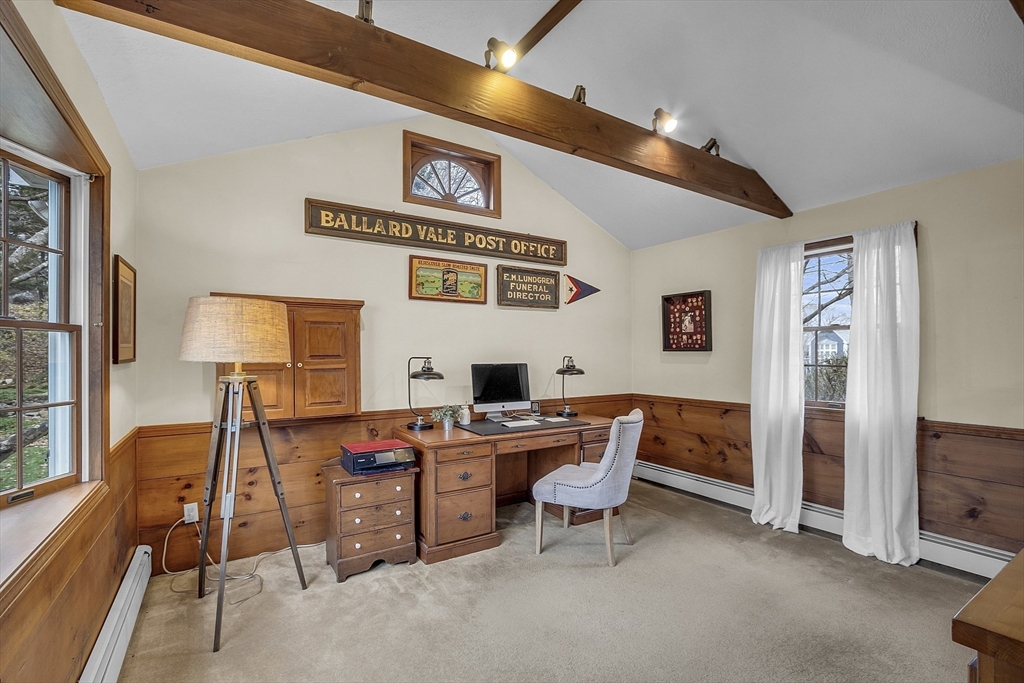 9 Carlisle Street Andover, MA 01810 - Photo 20 of 42 a work room with furniture and a flat screen tv