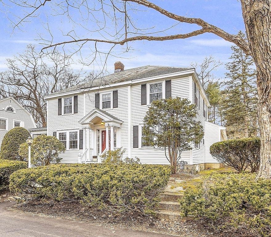 9 Carlisle Street Andover, MA 01810 - Photo 2 of 42 a front view of a house with garden