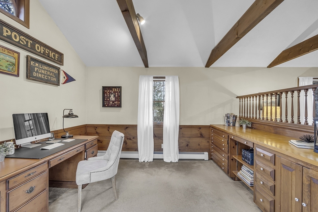 9 Carlisle Street Andover, MA 01810 - Photo 22 of 42 a bedroom with furniture and a baby crib