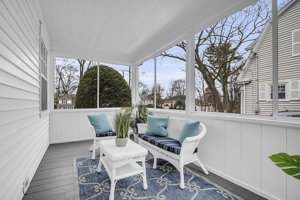 9 Carlisle Street Andover, MA 01810 - Photo 26 of 42 a view of a patio with couches table and chairs and wooden floor