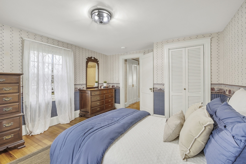 9 Carlisle Street Andover, MA 01810 - Photo 29 of 42 a bedroom with a bed and a television