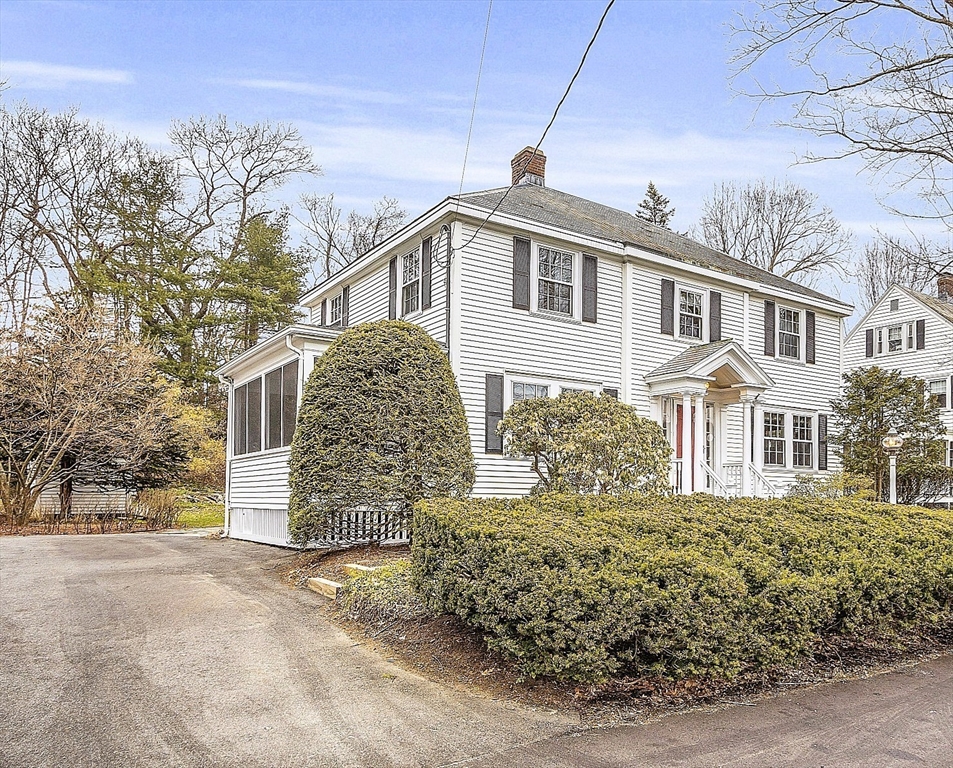 9 Carlisle Street Andover, MA 01810 - Photo 3 of 42 a front view of a house with a yard