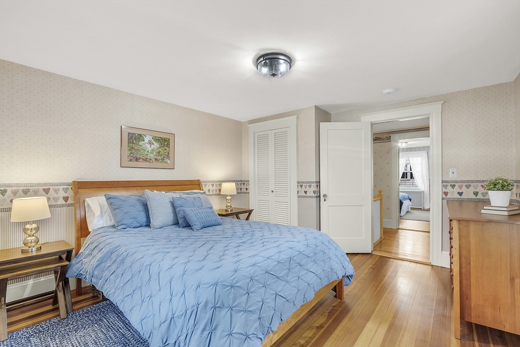9 Carlisle Street Andover, MA 01810 - Photo 31 of 42 a spacious bedroom with a bed and a table