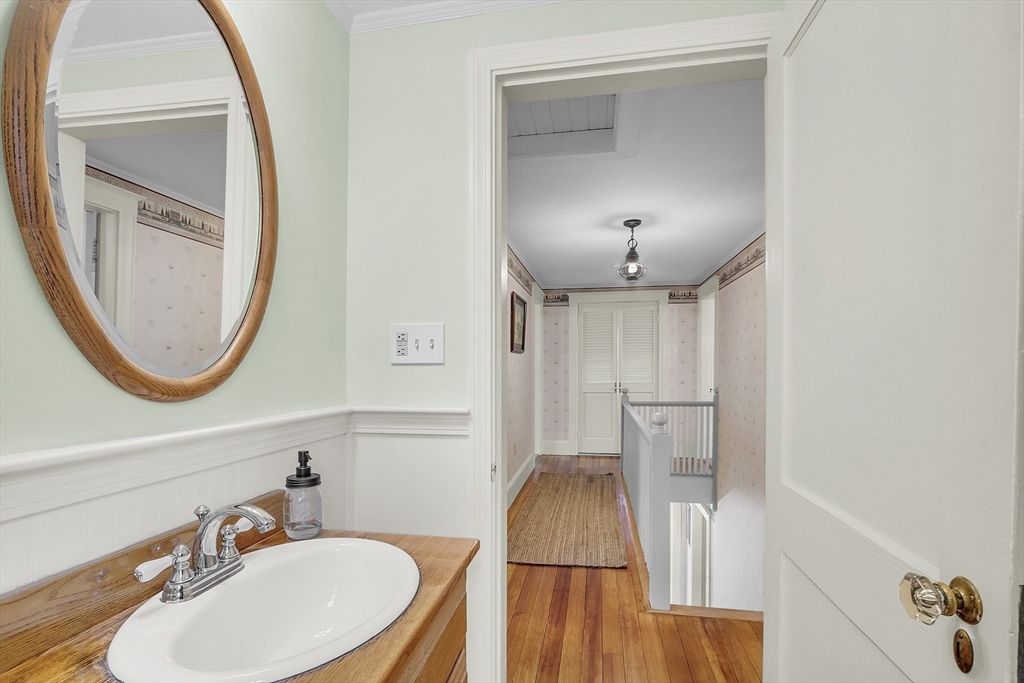 9 Carlisle Street Andover, MA 01810 - Photo 36 of 42 a bathroom with a sink and a mirror