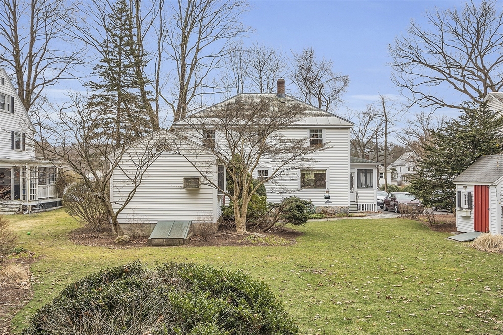 9 Carlisle Street Andover, MA 01810 - Photo 37 of 42 a front view of house with yard and trees around