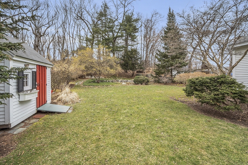 9 Carlisle Street Andover, MA 01810 - Photo 40 of 42 a backyard of a house with lots of green space