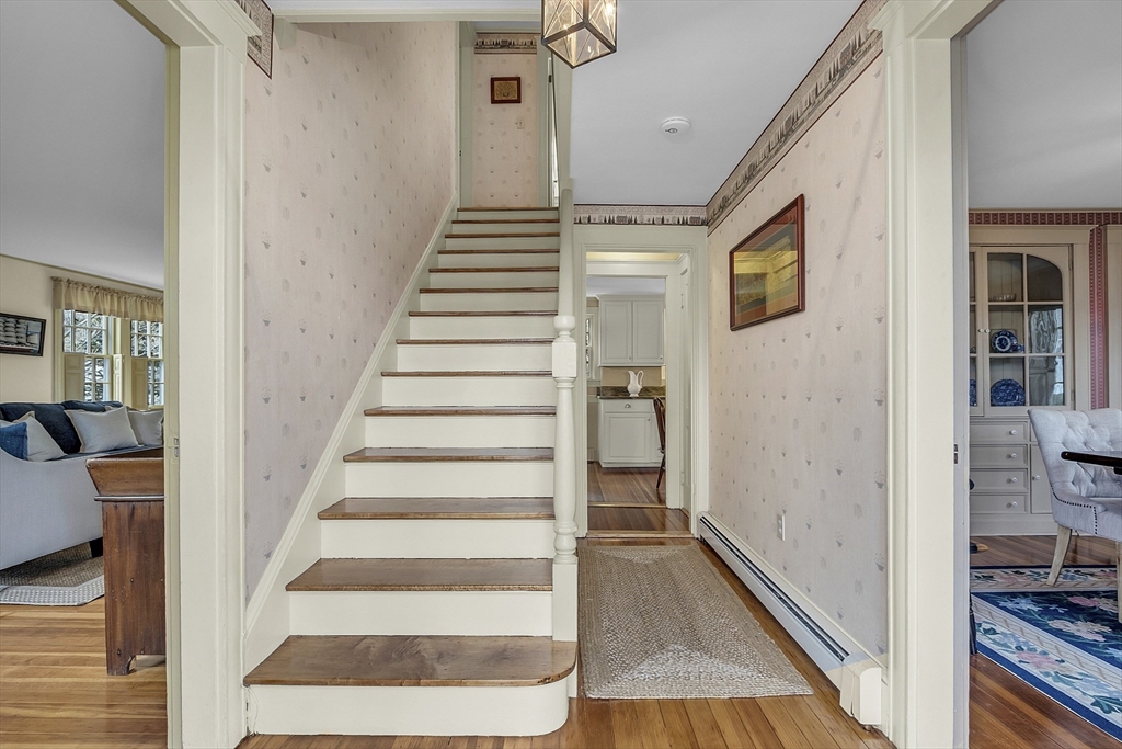 9 Carlisle Street Andover, MA 01810 - Photo 4 of 42 a view of a hallway with wooden floor and entryway