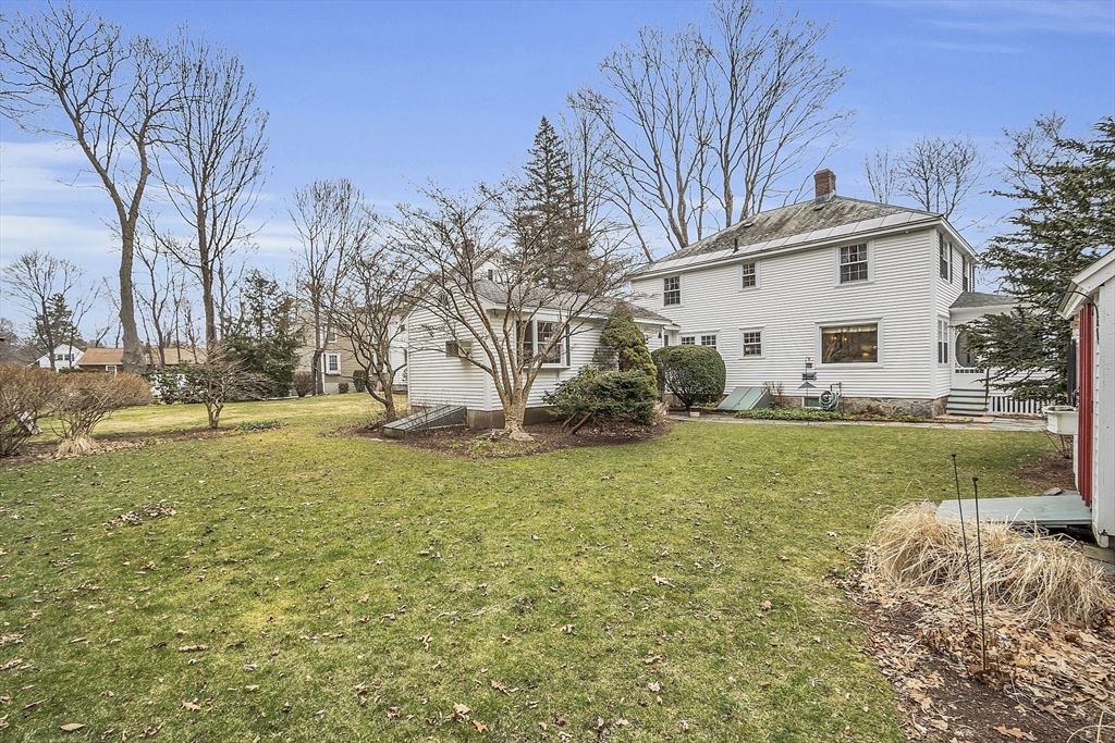 9 Carlisle Street Andover, MA 01810 - Photo 42 of 42 a view of a house with a yard