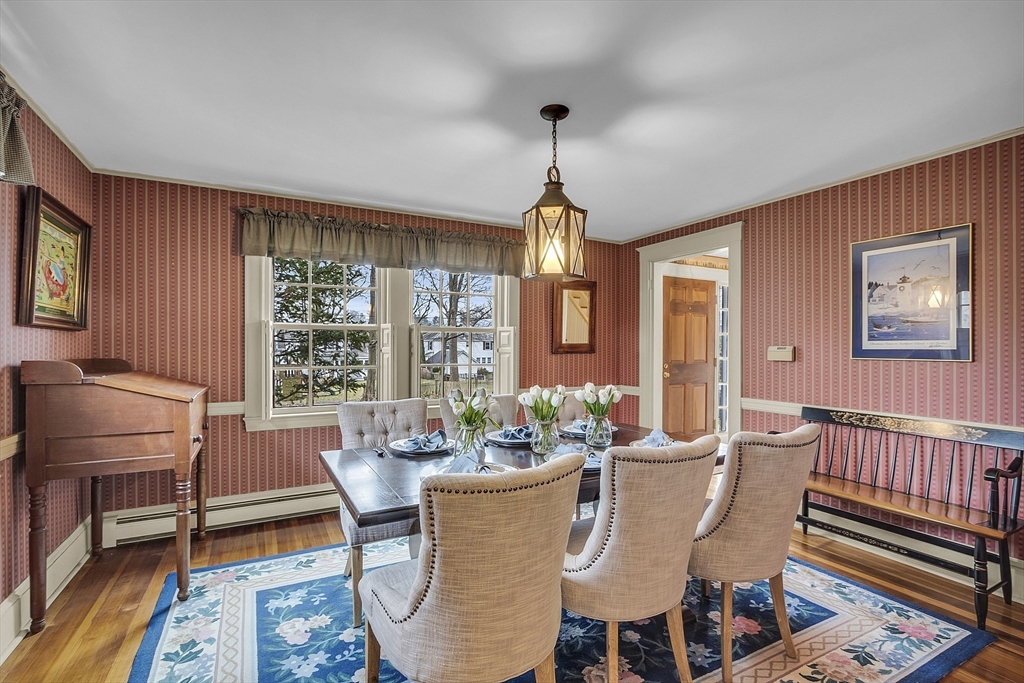 9 Carlisle Street Andover, MA 01810 - Photo 8 of 42 a dining room with furniture a chandelier and wooden floor