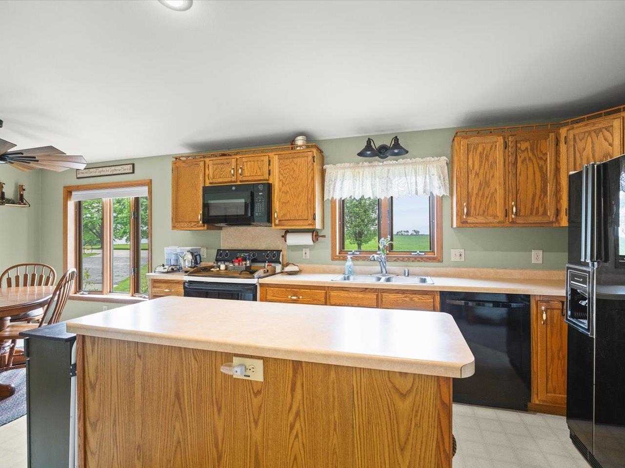 8500 Manchester Road Capron, IL 61012 - Photo 23 of 51 a kitchen with stainless steel appliances a sink stove and cabinets
