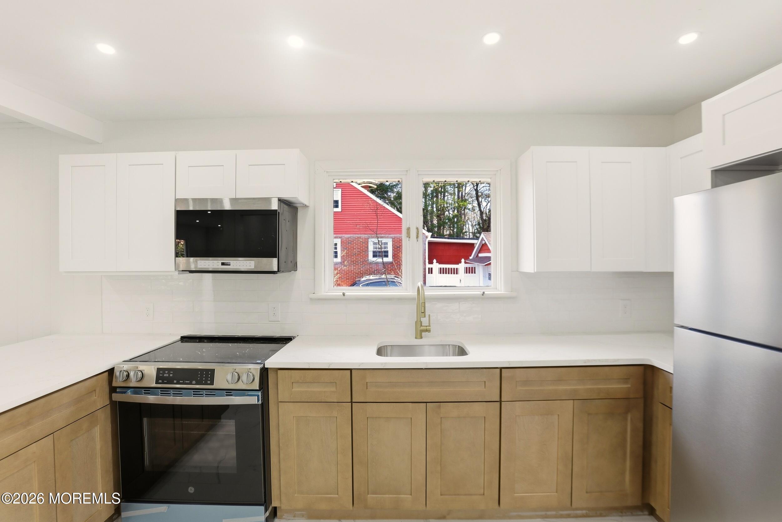 9 Riccis Drive Jackson, NJ 08527 - Photo 1 of 30 a kitchen with stainless steel appliances granite countertop a sink stove and refrigerator