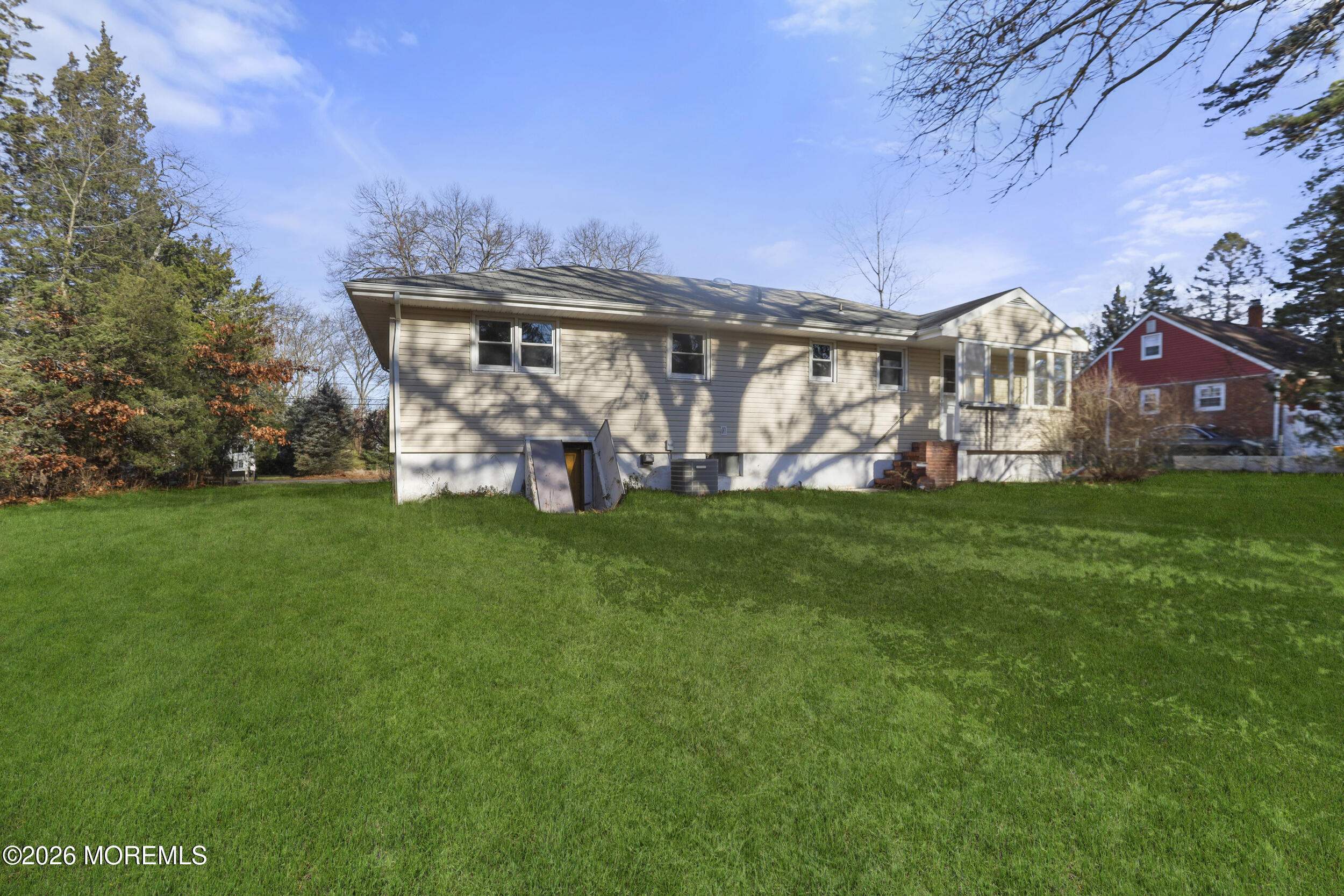 9 Riccis Drive Jackson, NJ 08527 - Photo 17 of 30 a front view of a house with a garden and plants