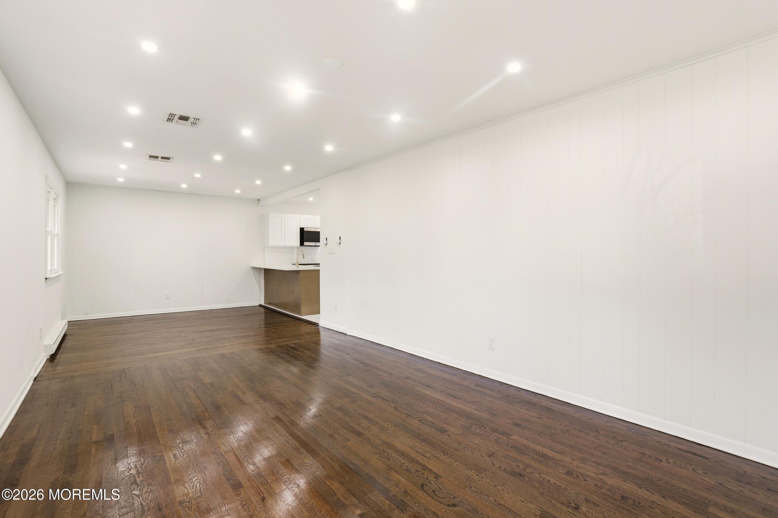 9 Riccis Drive Jackson, NJ 08527 - Photo 24 of 30 a view of empty room with wooden floor