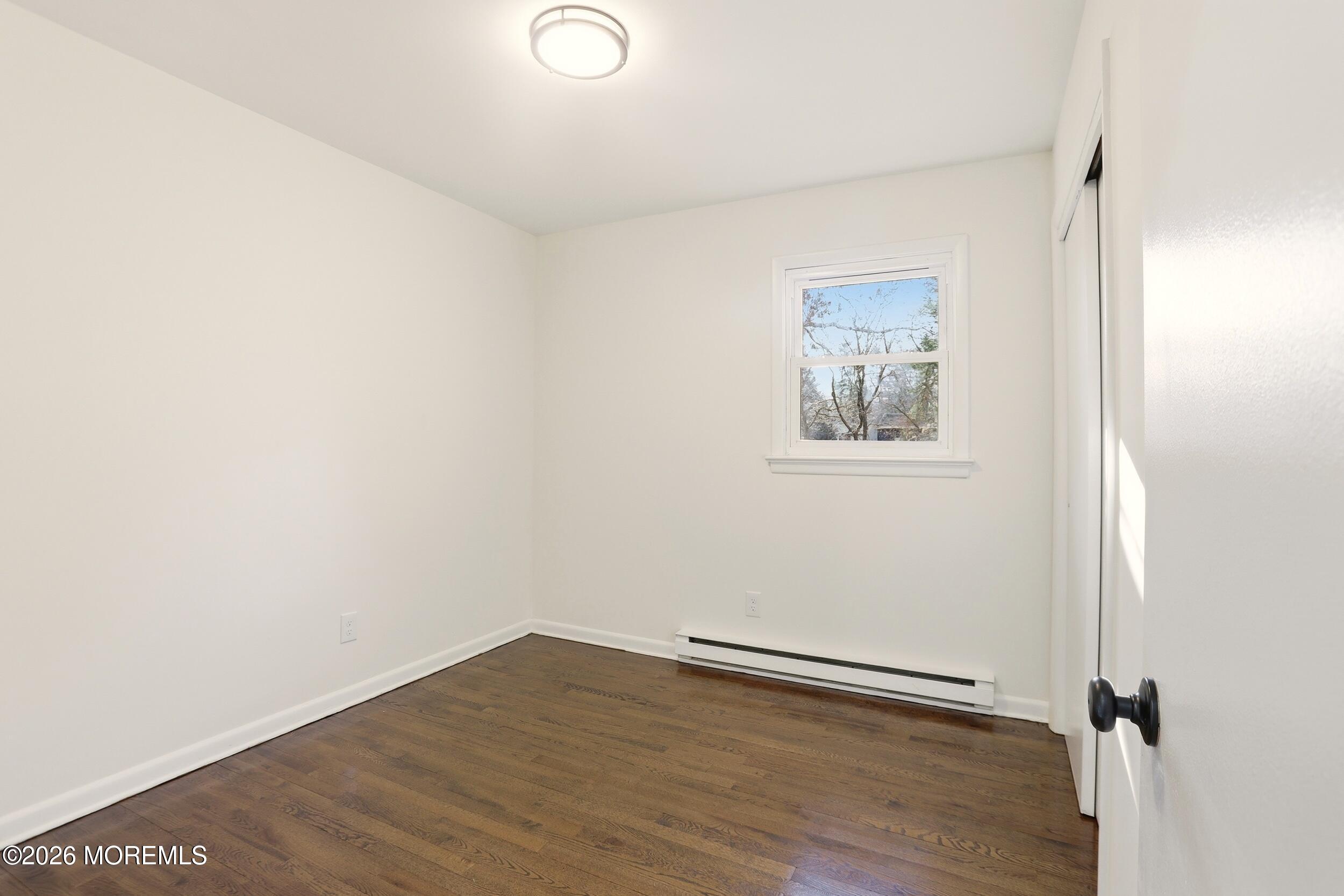 9 Riccis Drive Jackson, NJ 08527 - Photo 5 of 30 an empty room with a workbench